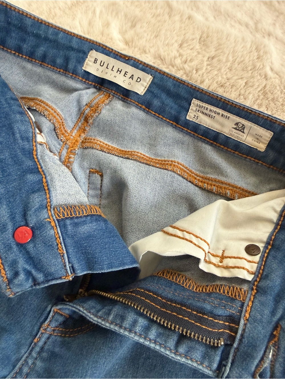 Bullhead Denim Co. High-Rise Skinny Jeans in Medium Blue with Orange Stitching